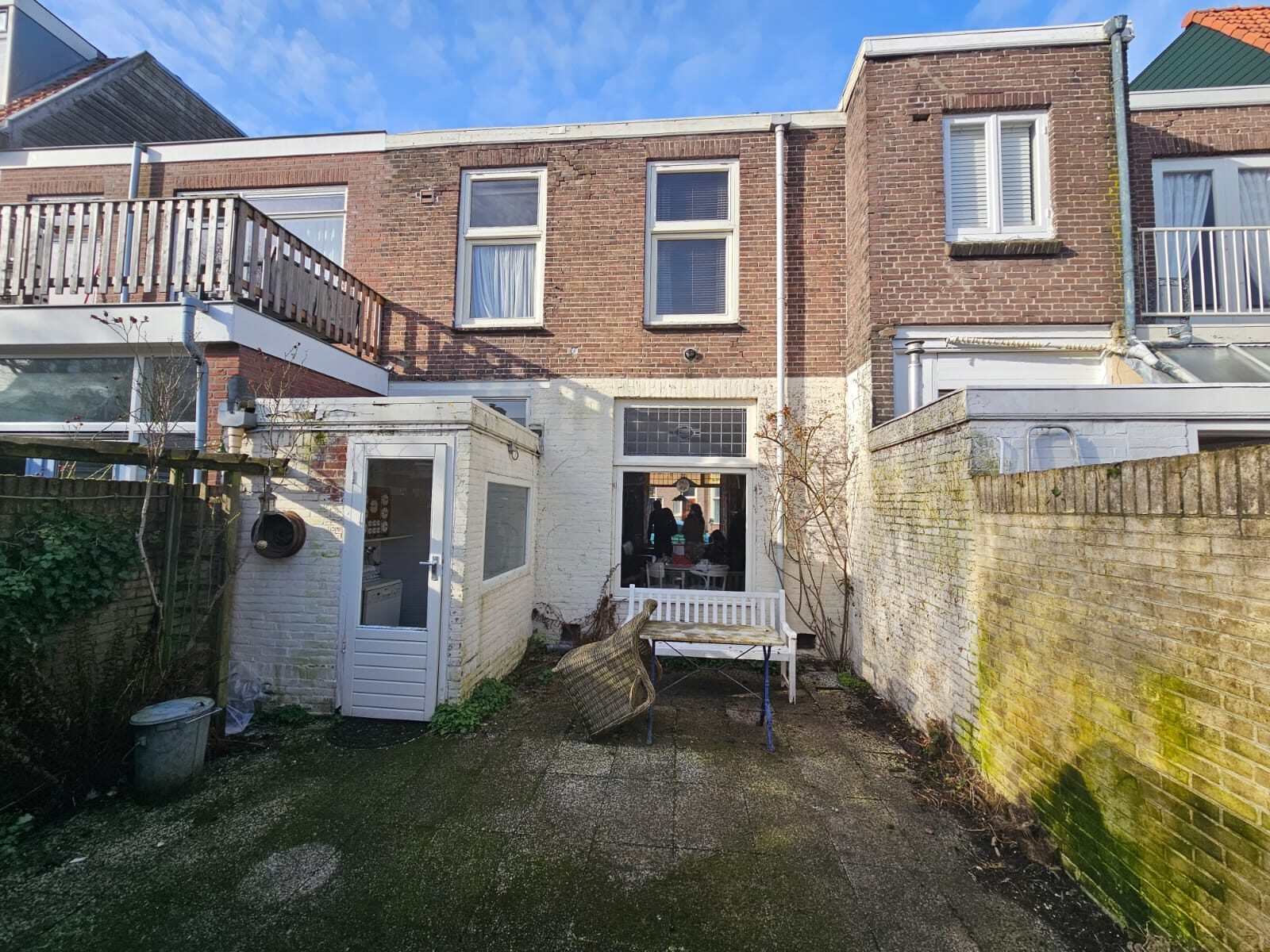 Before: the garden behind the house with a small annex