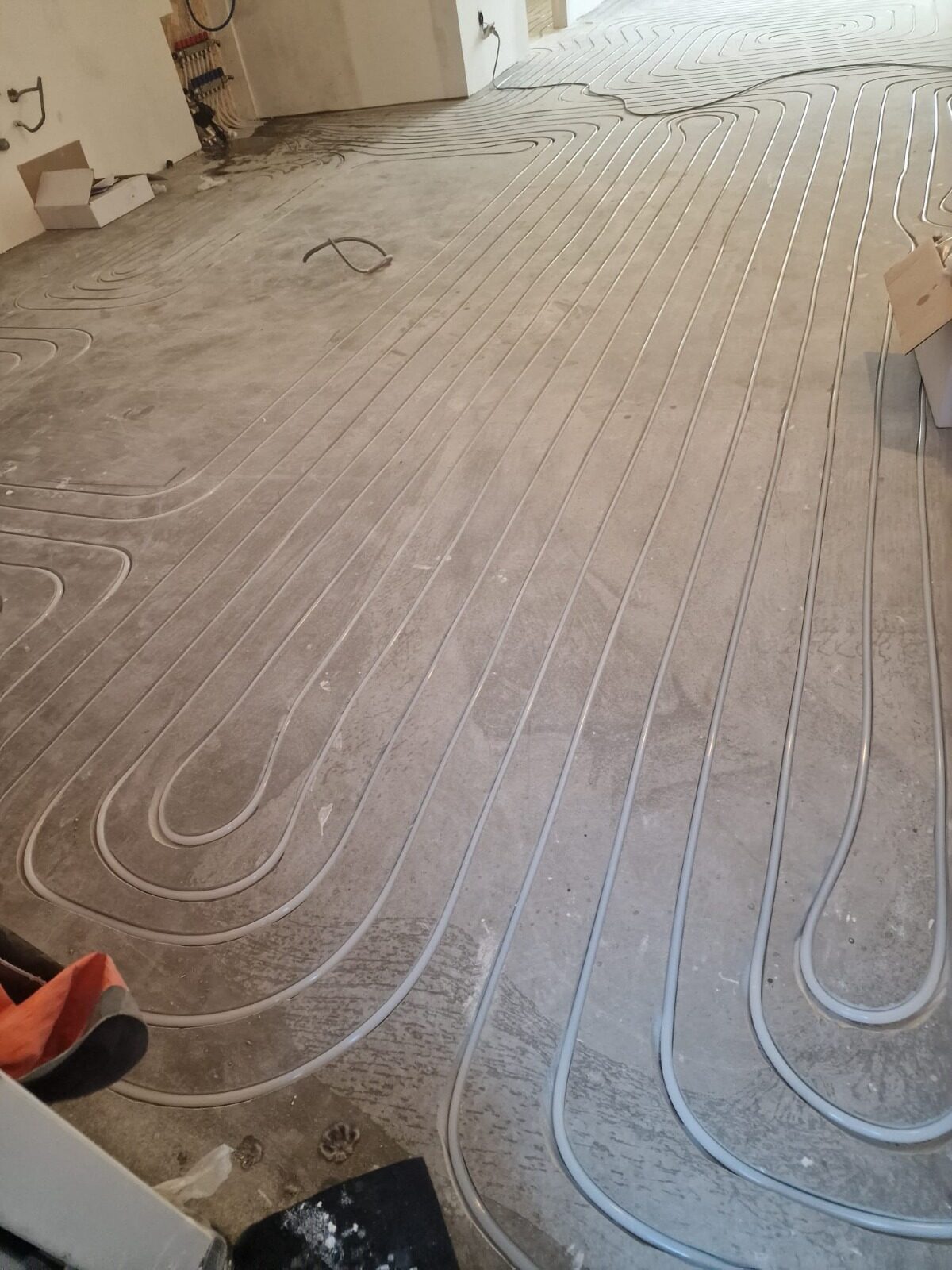 Underfloor heating pipes laid across the ground floor