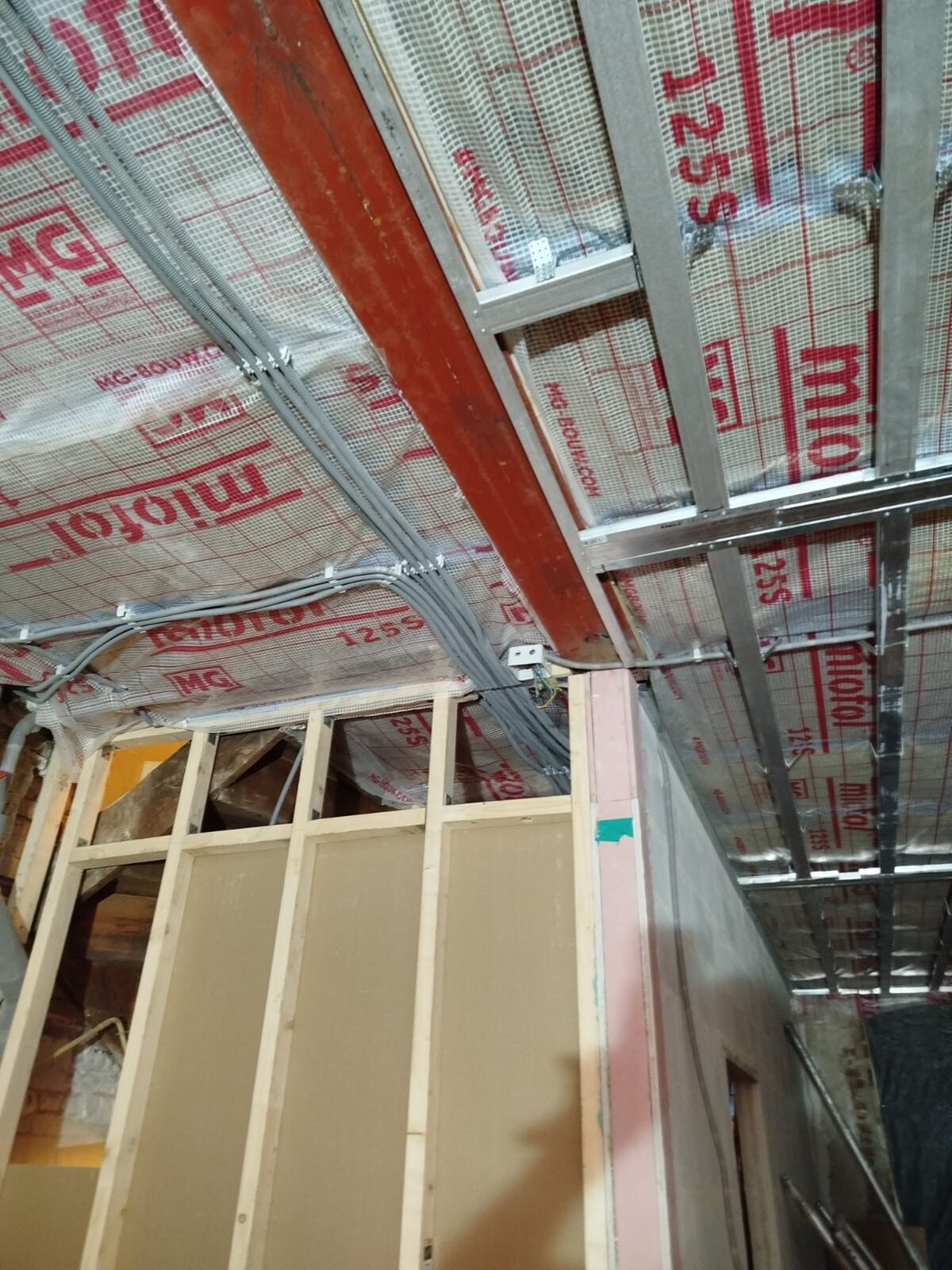 Foil-faced insulation boards between the ceiling joists