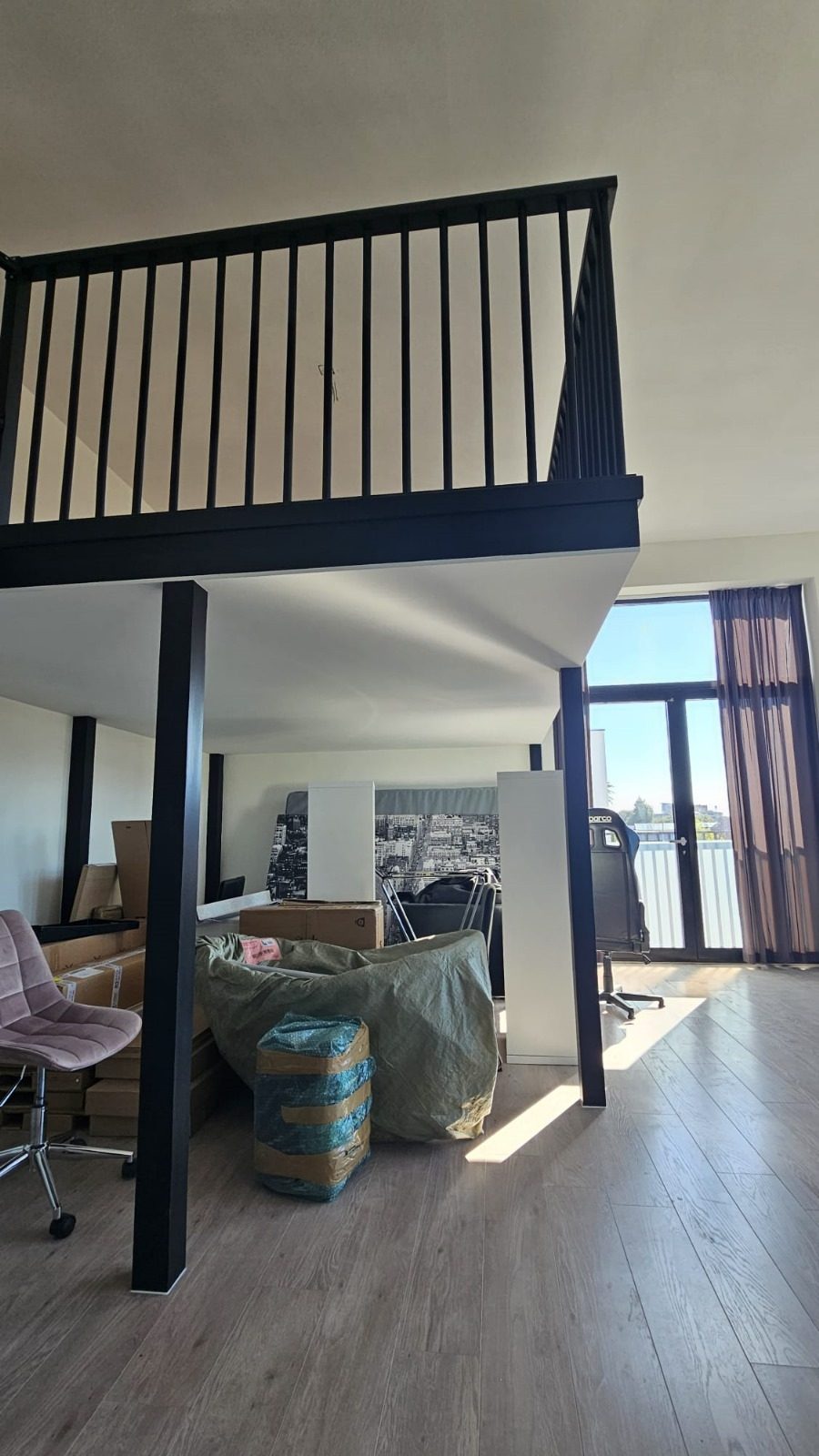 After: a mezzanine with a balustrade above the living space