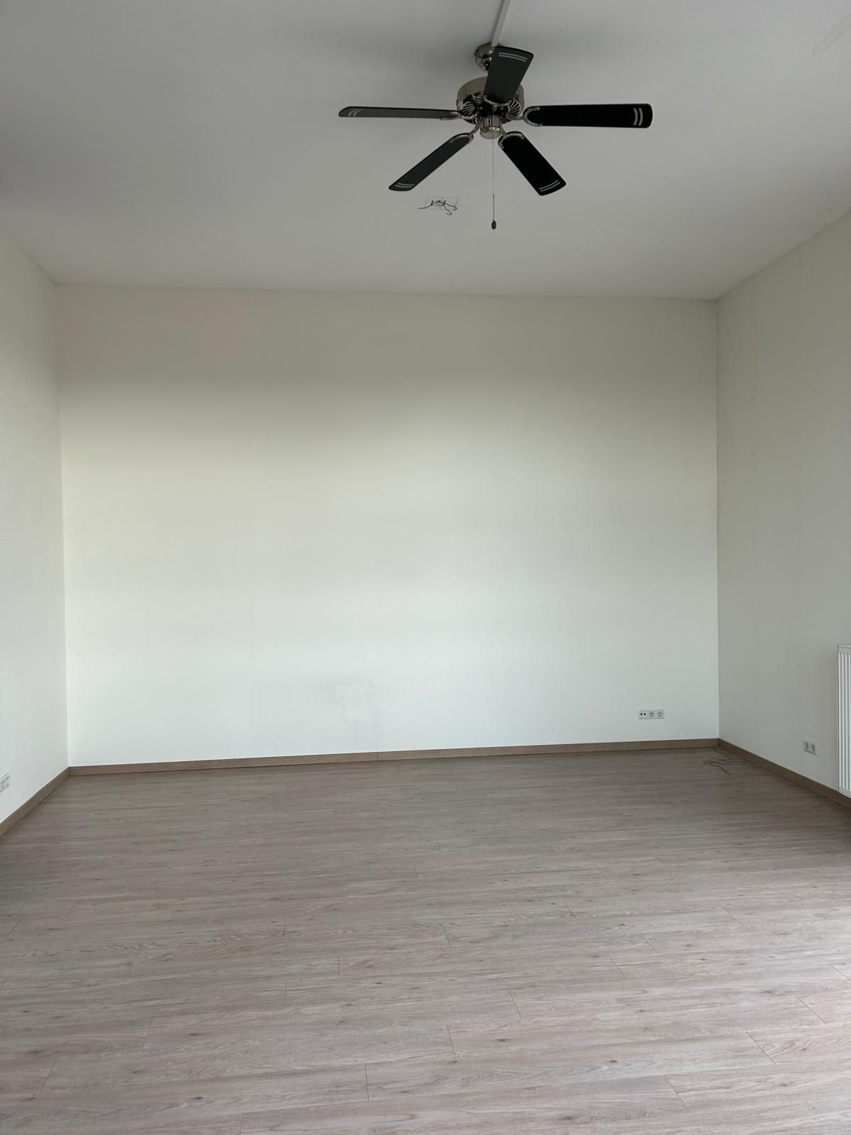 Before: an empty room with a high ceiling