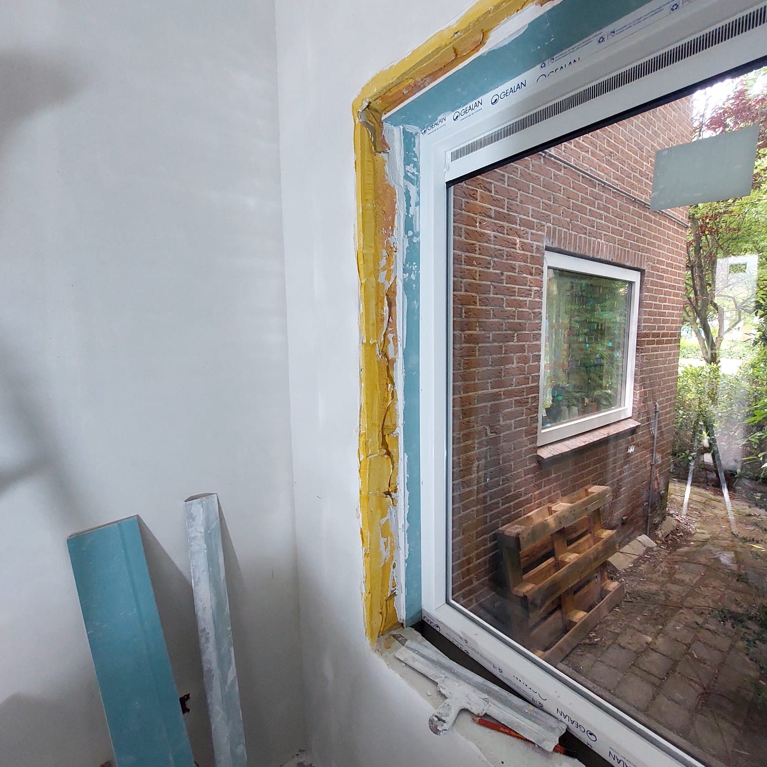 A new window frame set into the wall of the extension