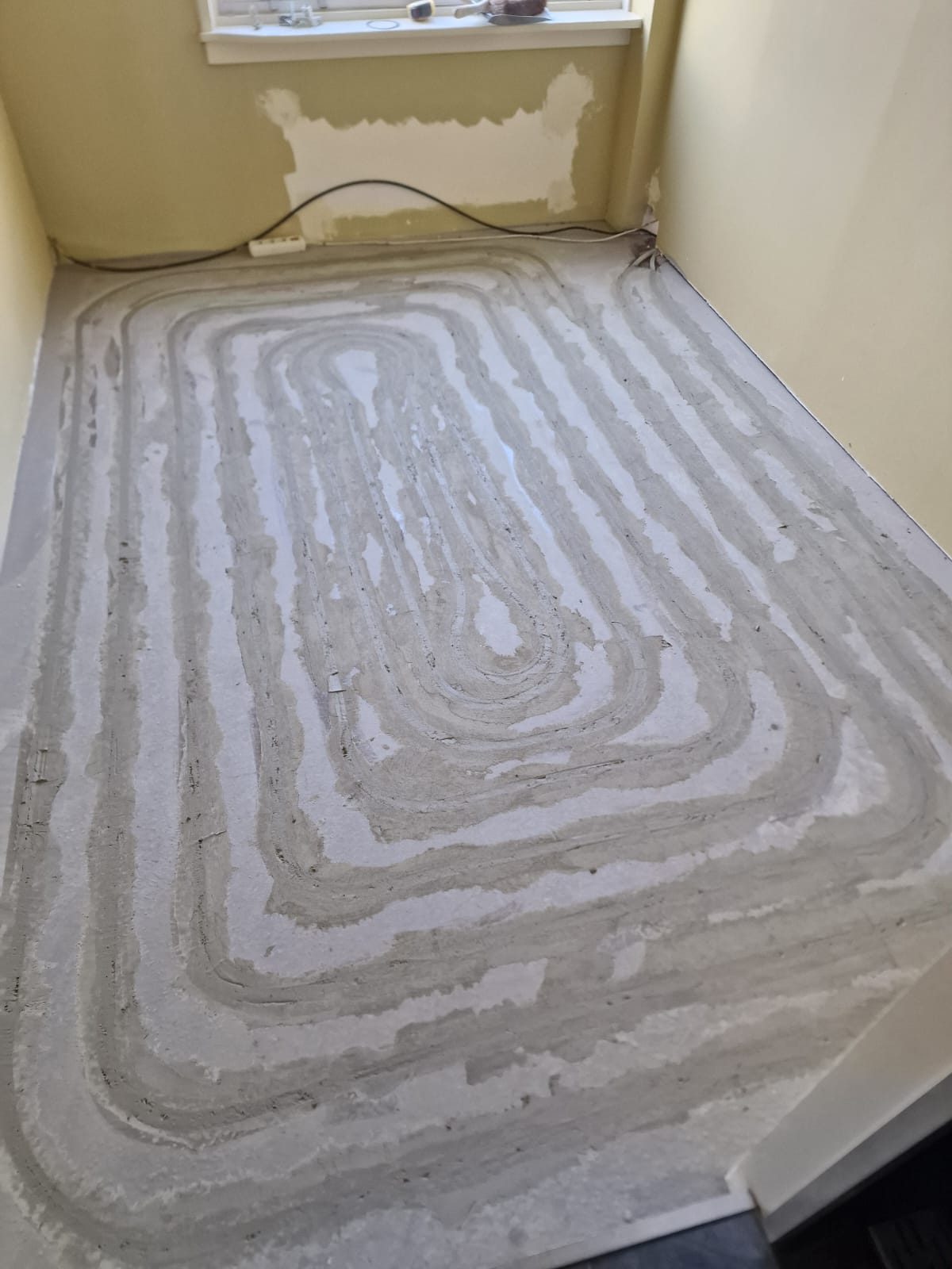Before: heating pipes in milled channels, closed with mortar